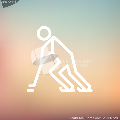 Image of Hockey player pushing the puck thin line icon
