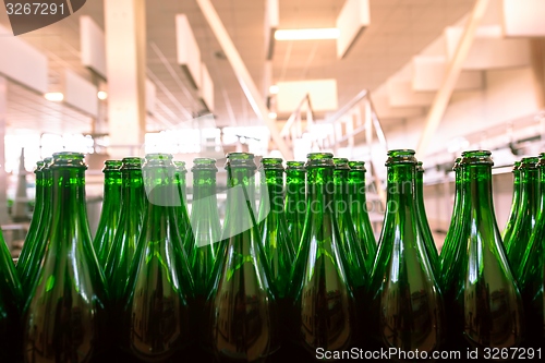 Image of Many bottles on conveyor belt