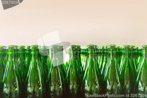 Image of Many bottles on conveyor belt