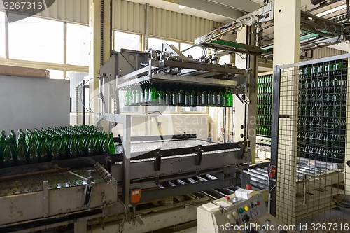 Image of Bottling machine with many bottles