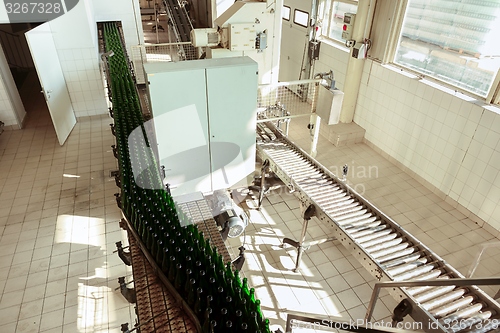 Image of Many bottles on conveyor belt