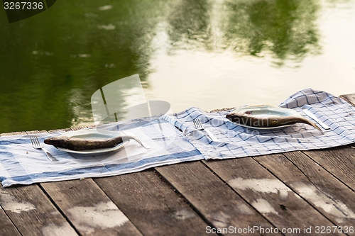 Image of Wooden deck with fish on it