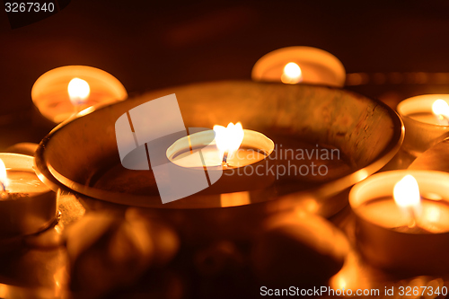 Image of Candles burning at altar