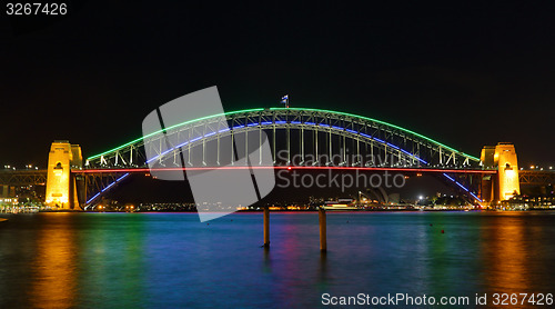 Image of Sydney Harbour Bridge illuminated in colours for Vivid Sydney