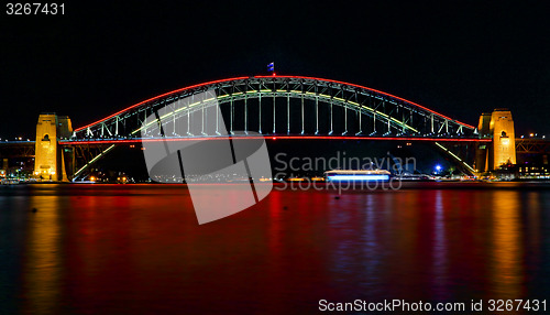 Image of Sydney Harbour Bridge lights in red for Vivid Sydney Festival