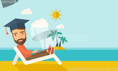 Image of Man with laptop on the beach 