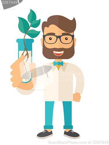 Image of Chemist with tube and eco leaves.