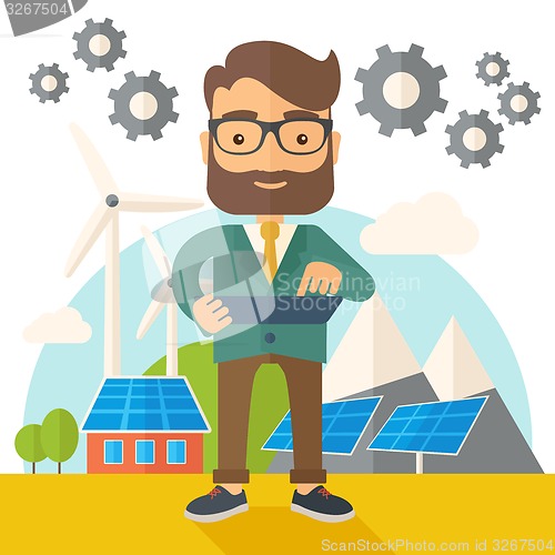 Image of Mid adult male engineer holding blueprint.