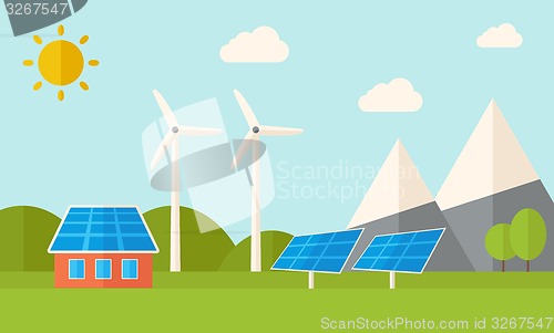 Image of House with solar panels and wind mills.