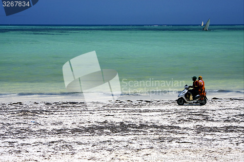 Image of scooter in the beach of zanzibar
