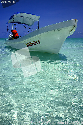 Image of boat in the blue lagoon  in mexico