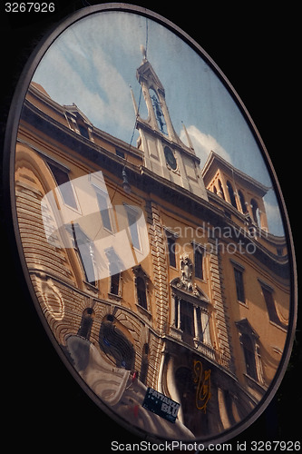 Image of the reflex of palazzo della posta in a mirror