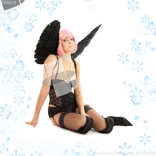 Image of black lingerie angel with pink hair and snowflakes