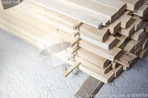 Image of Lumber stacked at a construction site 