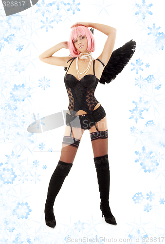 Image of dancing black lingerie angel with pink hair and snowflakes