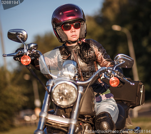 Image of Biker girl on a motorcycle