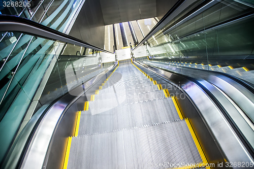 Image of Airport moving sidewalk also travelator, walkalator and movator.