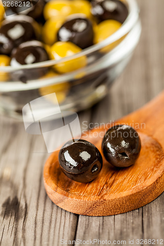 Image of Olives on a wooden table