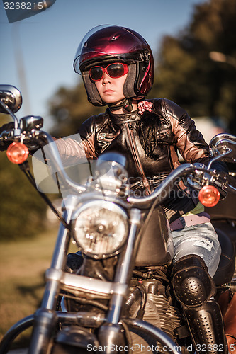 Image of Biker girl on a motorcycle