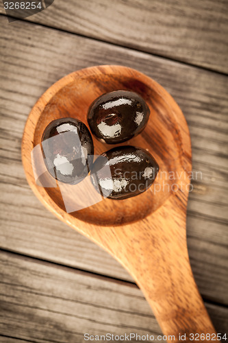 Image of Olives on a wooden table