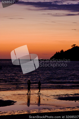 Image of two men in the sunset and the mountain