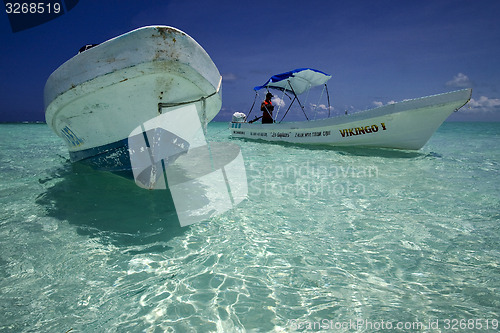 Image of boats in sian kaan mexico blue lagoon