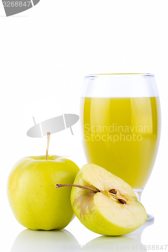 Image of Apple juice in glass and green apples