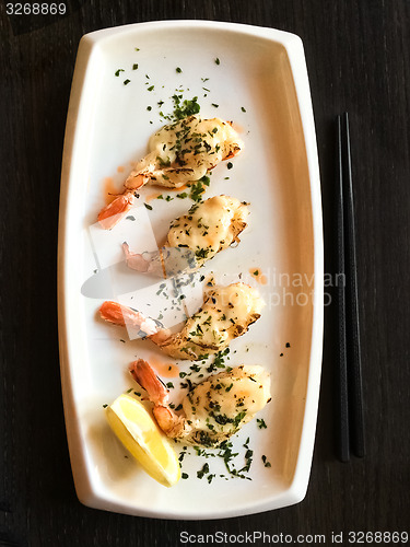 Image of White plate with grilled shrimps