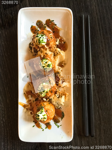 Image of Creamy octopus balls on white plate