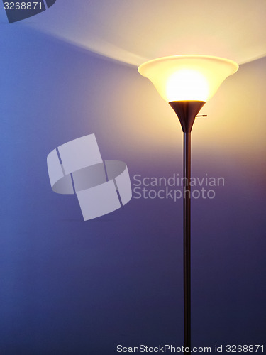 Image of Bright lamp on purple background