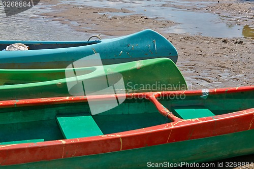 Image of Canoes on the Riverside