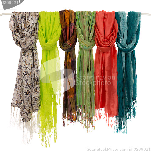 Image of colored scarves on a hanger