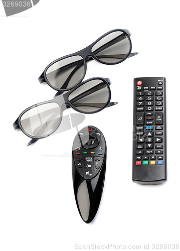 Image of Two pairs of 3D glasses and remote control TV