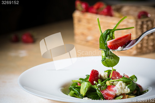 Image of Fresh Salad with strawberries, goat cheese and shrimps