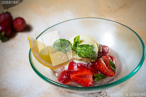 Image of Ice cream with fresh strawberries