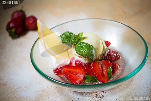 Image of Ice cream with fresh strawberries