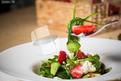 Image of Fresh Salad with strawberries, goat cheese and shrimps