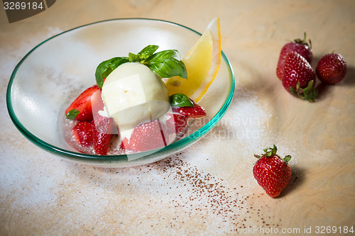 Image of Ice cream with fresh strawberries