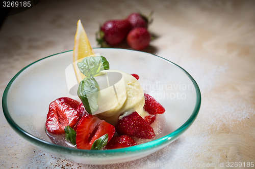 Image of Ice cream with fresh strawberries