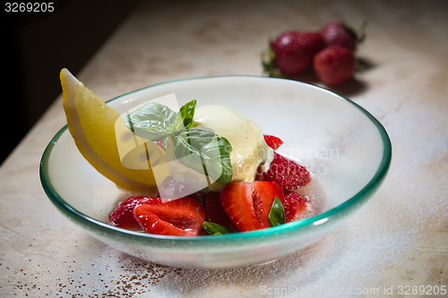 Image of Ice cream with fresh strawberries