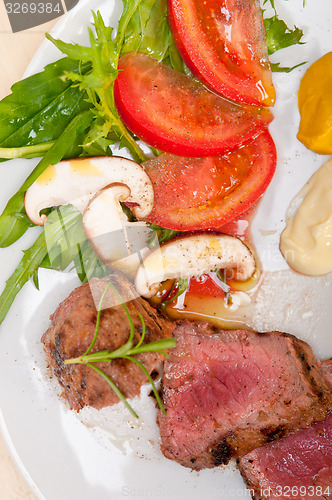 Image of beef filet mignon grilled with vegetables