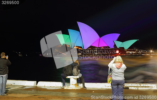 Image of Tourists brave the rain on Opening Night Vivid Sydney