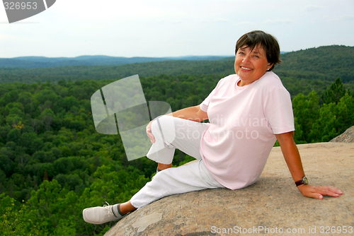 Image of Woman edge cliff