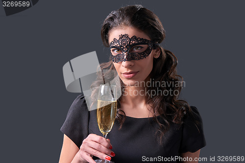 Image of Party woman holding glass with champagne