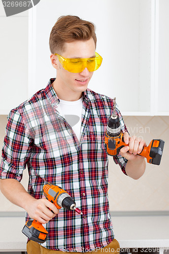 Image of worker with drill