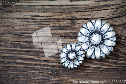 Image of metal vintage buttons in flower image