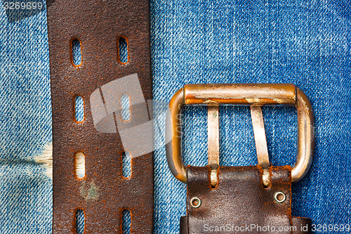 Image of Aged leather belt with a buckle