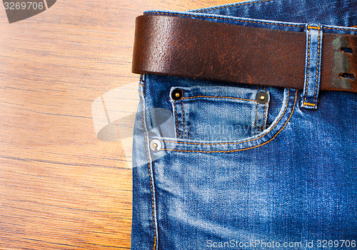 Image of jeans with leather belt