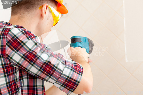 Image of worker with rock-drill