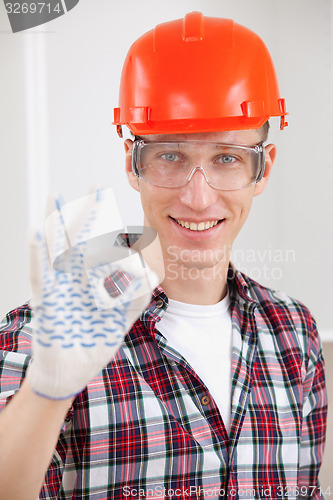 Image of repairman making a perfect gesture